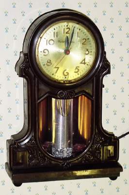 C.1940, MasterCrafters Clock Corp, Chicago, IL, MODEL 434, Liquid Motion, 110v, electric timepiece, light and "boiling" liquid. — Antique Clocks Price Guide