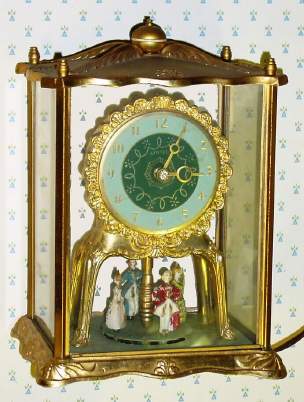 C.1940, United Electric Clock Corp, Brooklyn, NY, DANCING LADIES, 100v, electric timepiece, the 4 painted ladies dancing and turning on a turntable below the clock. — Antique Clocks Price Guide