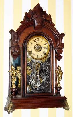 C.1885, Ansonia Clock Co., Ansonia, Conn., "Windsor" , 8-day time/strike/alarm mirror side parlor clock, with cast metal feet. — Antique Clocks Price Guide