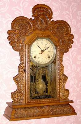 C.1915, E. Ingraham and Co., Bristol, Conn., 8-day time/strike calendar mantel clock. Must have been a gray Monday when this was assembled, as it has the top of a Gila and sides and base of a Delaware. — Antique Clocks Price Guide