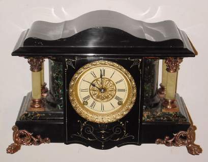 C.1900, Seth Thomas, Thomaston, Conn, Adamantine, large model with rounded ends, 4 full columns and serpentine top. — Antique Clocks Price Guide