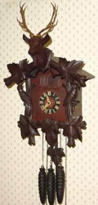 C.1935, German, 30-hour Cuckoo and Quail [quarter strike] clock, 3-weight, by Henry Coehler — Antique Clocks Price Guide