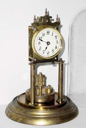 C.1905, Kienzle Clock Factories, 400-day torsion timepiece in very good condition with an original disc pendulum. — Antique Clocks Price Guide