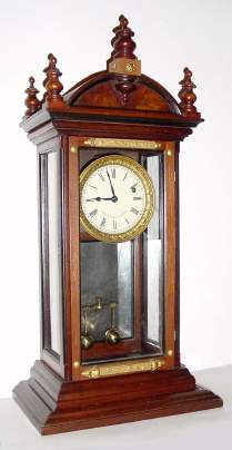 Mixed lot: Time train from an A. D. Crane Year movement, now set into a new set of plates, mounted into a Victorian display cabinet, with a metal panel in the lower section. — Antique Clocks Price Guide