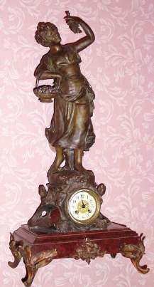 C.1895 French, Vincenti and Cie, 8-day time/strike figural mantel clock, large, girl in the garden with a basket of fruit and grapes in her hand. — Antique Clocks Price Guide