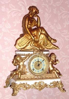Mixed lot, good parts, C.1904 Ansonia Clock Co., 8-day time/strike figural mantel clock, SIBYL base with incorrect top statue. — Antique Clocks Price Guide