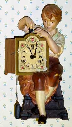 C.1920, French, Novelty Clock BOY WITH CLOCK, hand painted spelter with round lever, rear wind movement, 1-day. — Antique Clocks Price Guide