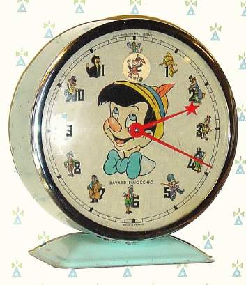 C.1965, Bayard, France, "Pinocchio" , 30-hour novelty alarm timepiece, bound up (designed for disc with Jimminy Cricket to rock back and forth as clock runs. — Antique Clocks Price Guide