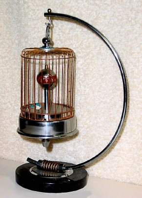 C.1947, Occupied Japan, 30-hour birdcage with rotating globe (annular dial), novelty timepiece with original marble and chrome base. — Antique Clocks Price Guide