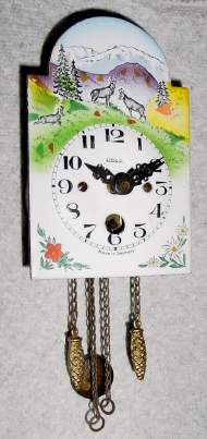 C.1955, German, Heco [Henry Kohler], Mini Pendulette , with porcelain dial, depicting several mountain antelope, 30-hour. — Antique Clocks Price Guide