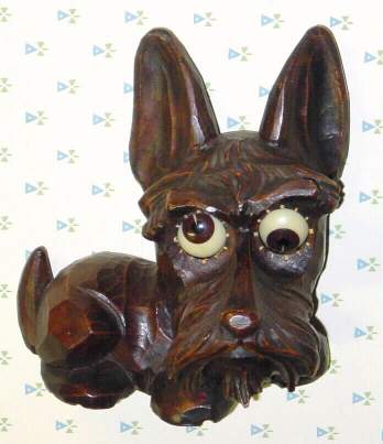 C.1948, German, Oswald, Molded Composition, SCOTTY dog, one day, eyes roll 'round to indicate the time. — Antique Clocks Price Guide