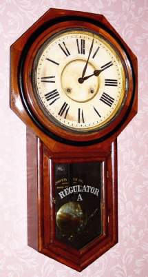 C.1906, Ansonia Clock Co., NY, REGULATOR A, octagon long drop school clock with black walnut veneer, 8-day time and strike. — Antique Clocks Price Guide
