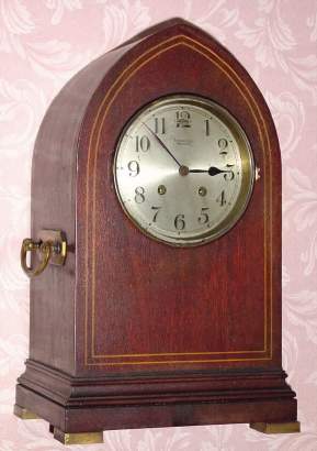 C.1910 Chelsea Clock Co., Boston. Mass., "Gothic", 8-day "House Strike" clock retailed by Tiffany and Co., New York with the serial no. 68075 in an inlayed mahogany case. — Antique Clocks Price Guide