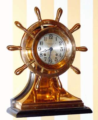 C.1924, Chelsea Clock Co., Boston, Mass., "Mariner" , 8-day ship's bell clock serial number 161273 in a polished red brass case, 4.5" dial, with a Chelsea winding key. This model was originally identified as "The Yacht Wheel with base", but in 1928 the name was changed to the Mariner. — Antique Clocks Price Guide