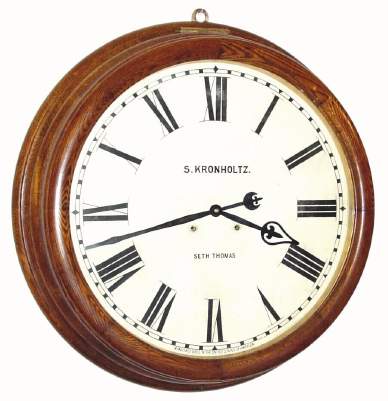 C.1890, Seth Thomas Clock Co, Thomaston, Conn, "GALLERY 24-INCH" , in oak, with original dial with store name "S. Kronholtz". — Antique Clocks Price Guide