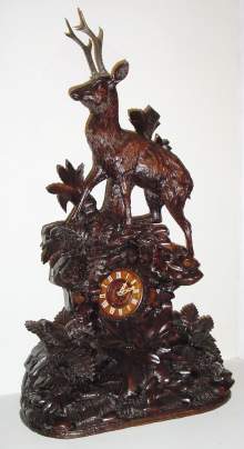 C.1890, Swiss/Black Forest, Giant carved mantel clock, stag in the forest, the movement of best French design, hour and half strike on a gong. — Antique Clocks Price Guide