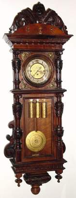 C.1875, Austrian, 3-Wt, Grand Sonnerie, walnut case wall clock, double door style with engraved weights and matching pattern on dial and pendulum. — Antique Clocks Price Guide