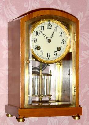 C.1914, Waterbury Clock Co., Waterbury, Conn., "Trouville" , 8-day time/strike crystal regulator mantel clock. — Antique Clocks Price Guide