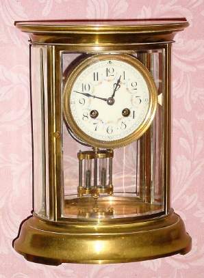 C.1900, French, Oval Crystal regulator , 8-day time and gong strike. — Antique Clocks Price Guide