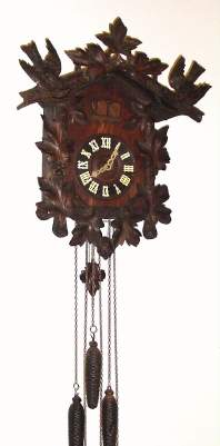 C.1900, German, 30-hour Cuckoo and Quail wall clock, with 3 weights, all carvings of oak. — Antique Clocks Price Guide