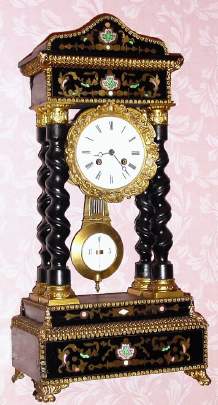 C.1880, French, 4-column Empire style ebonized clock with pressed brass trim and feet, and inlay of brass and MOP, 8-day time and bell strike. — Antique Clocks Price Guide