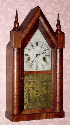 C.1860, Ansonia Brass Co., Ansonia, Conn, SHARP GOTHIC, or steeple clock, 30 hour time and strike in a striped mahogany case. — Antique Clocks Price Guide