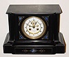  C.1890, French, for Palmer Bachelder's and Co., Boston, BLACK SLATE mantel clock with blue onyx inserts and gilt trim, clean movement with open escapement on dial. 