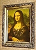  C.1980, US, Pennsylvania, Wandering eyes MONA LISA, 8-day time and strike, in a brushed gold frame, wall clock. 