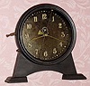  C.1921 English Gravity timepiece, The 30-hour movement is driven by a weight inside the case that is raised by a lever on the side with a visible escapement and a compound bar-bell pendulum, serial No. L5727. 