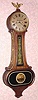  C.1920, New Haven Clock Co., "Wilson" , 30-day banjo timepiece, with oval lower door.