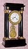  C.1870, French, 4-Column Empire Style ebonized case, 8-day time and bell strike mantel clock, new base, changed movement. 