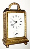  C.1890, French, Novelty Travel Alarm, (pivoted pendulette movement) in a gold painted white metal case with embossed brass rear cover that slides up for winding and setting the hands. 