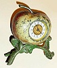 C.1900, Waterbury Clock Co., APPLE TIMEPIECE , one day novelty. Cast metal apple is hinged in the center, and opened to wind and set the movement. 