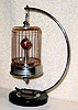  C.1947, Occupied Japan, 30-hour birdcage with rotating globe (annular dial), novelty timepiece with original marble and chrome base.