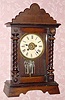  C.1910, German, Pine Cased mantel timepiece with alarm, one day. 