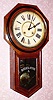  C.1906, Ansonia Clock Co., NY, REGULATOR A, octagon long drop school clock with black walnut veneer, 8-day time and strike. 
