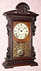  C.1886, Seth Thomas Clock Co., "CONCORD", from the City series, 8-day time and strike in an elaborate walnut case. 