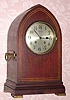  C.1910 Chelsea Clock Co., Boston. Mass., "Gothic", 8-day "House Strike" clock retailed by Tiffany and Co., New York with the serial no. 68075 in an inlayed mahogany case. 