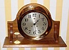  C.1923 Chelsea Clock Co., Boston. Mass., "Chelsea", 8-day ship's bell strike clock with the serial no. 158085 retailed by J. E. Caldwell and Co . (on dial) in a polished red brass case, 8 1/2" dial. (Now on a modern walnut stand)