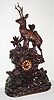  C.1890, Swiss/Black Forest, Giant carved mantel clock, stag in the forest, the movement of best French design, hour and half strike on a gong. 