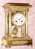  C.1890, French, Empire style, 8-day time/strike 4-pillar mantel clock in ormolu.