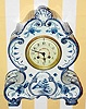 C.1900, German, Georg Schneider, porcelain case with a French 8-day time and bell strike movement.