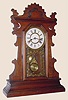  C.1890, New Haven, Black Walnut SHAMROCK, 8-day, time and strike gingerbread clock. 