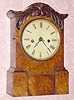  C.1855, Anglo-American shelf clock, with a Jerome/New Haven 8-Day fusee, time and strike movement in an attractive burled veneer case, probably by Holloway. 