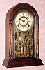  C.1870, Atkins Clock Co., Bristol, Conn, "CENTENNIAL" , model rosewood parlor clock, 8-day time and strike. 