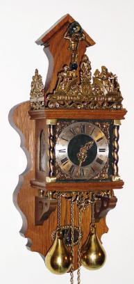 C.1960, German/Dutch, re-issue of a Dutch Zaanse clock, 2-weight, 8-day, surmounted by a figure of Atlas holding the world. — Antique Clocks Price Guide