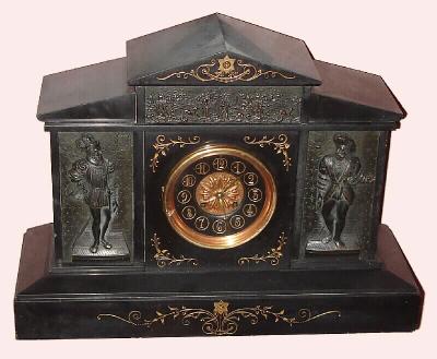 C.1890, French, Black Slate and Bronze mantel clock, 8-day, gong strike with frieze across the top and a figure either side of the dial in 17C ruffles and tights dress. — Antique Clocks Price Guide