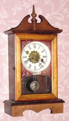 C.1890, William L. Gilbert CHROMO TIME, cottage clock with broken arch scroll top, 30 hour time and alarm. — Antique Clocks Price Guide