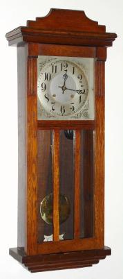 C.1920, New Haven Clock Co., 8-day time/strike mission style for the English market wall clock. We couldn't find this clock in the catalog, but the movement was made by New Haven, and is original to the case. — Antique Clocks Price Guide