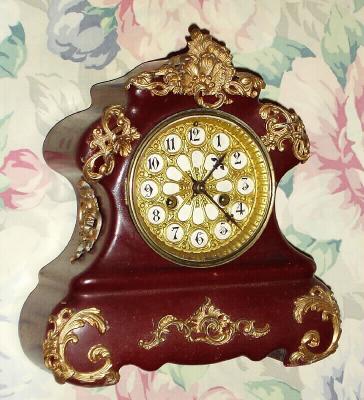 C.1906, Waterbury Clock Co., "Susa Wine", 8-day time gong strike, enameled iron mantel clock. — Antique Clocks Price Guide